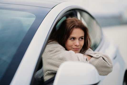 Tesla 3 with woman out of window